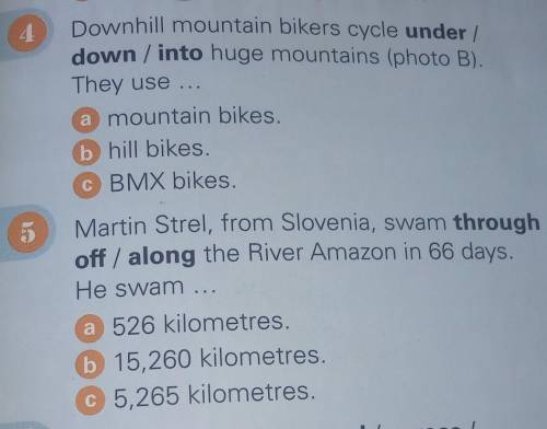 Downhill mountain bikers cycle under / down / into huge mountains (photo B).They use ..a mountain bi